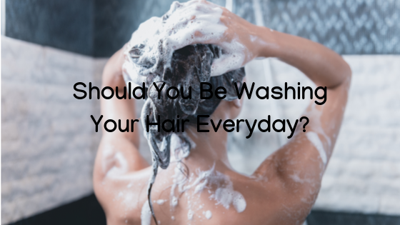 woman washing her hair with article title over top