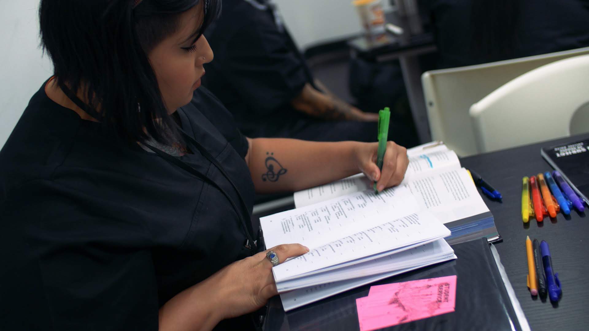 student studying out of book